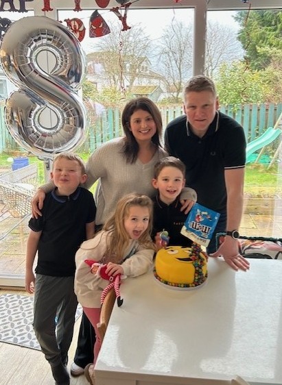 Image of Natalie and her family at a birthday party